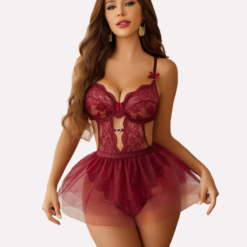 Burgundy lace bodysuit with underwire cups, sweetheart neckline, and sheer mini skirt. Features adjustable straps & heart charm.