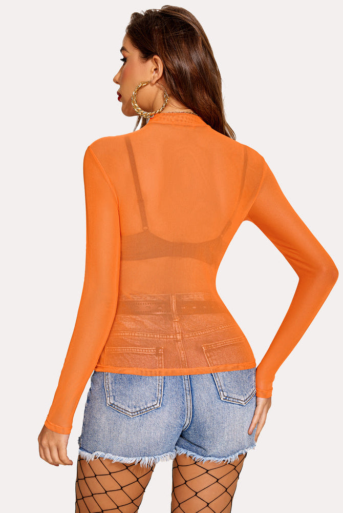 Orange mesh crop top with denim shorts. See-through, sexy and confident look.