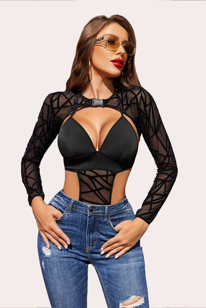 Black mesh shrug bodysuit with ripped jeans. Sexy rave lingerie outfit. Sunglasses say 'QUEEN'.