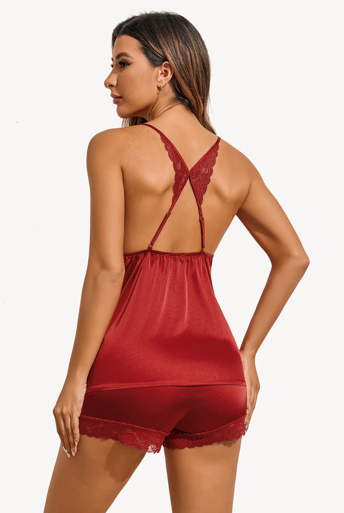 Dark red satin pajama set with open-back lace straps and matching lace-trim shorts