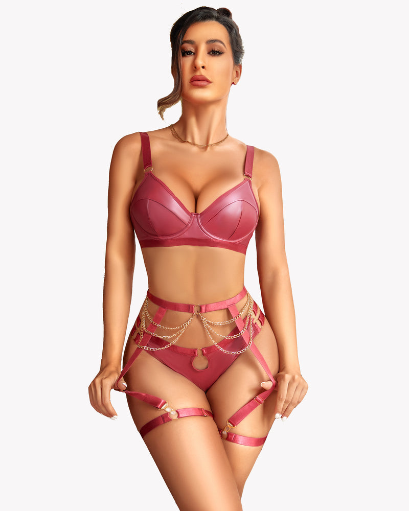 Rose leather lingerie set with garter belt and gold chain accents. Sensual design.