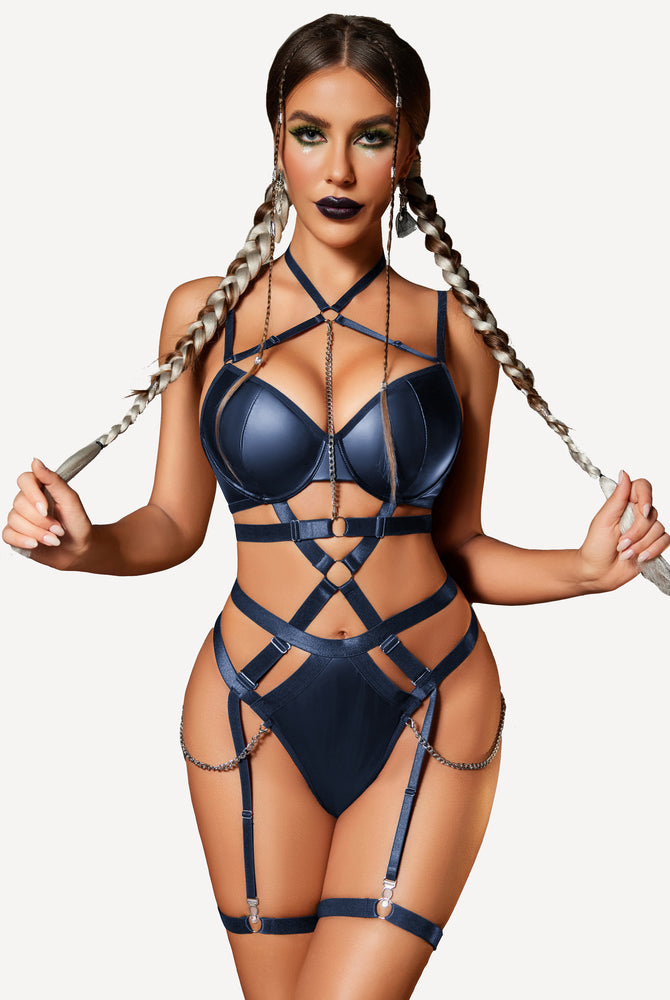 Navy blue lingerie set with chain detail and harness, creating confident, sexy look, push-up bra