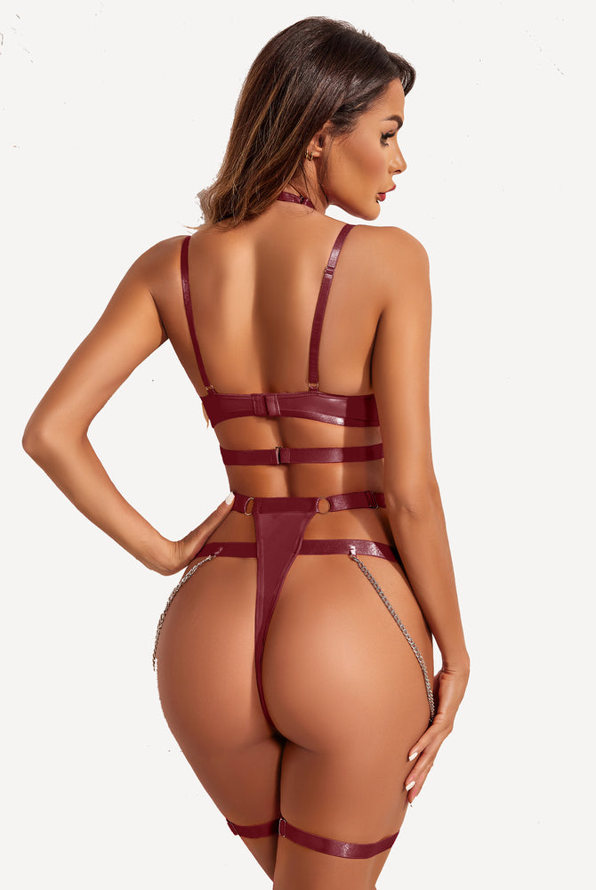 Burgundy lingerie set with chain detail, harness straps and garter for a confident and sexy look