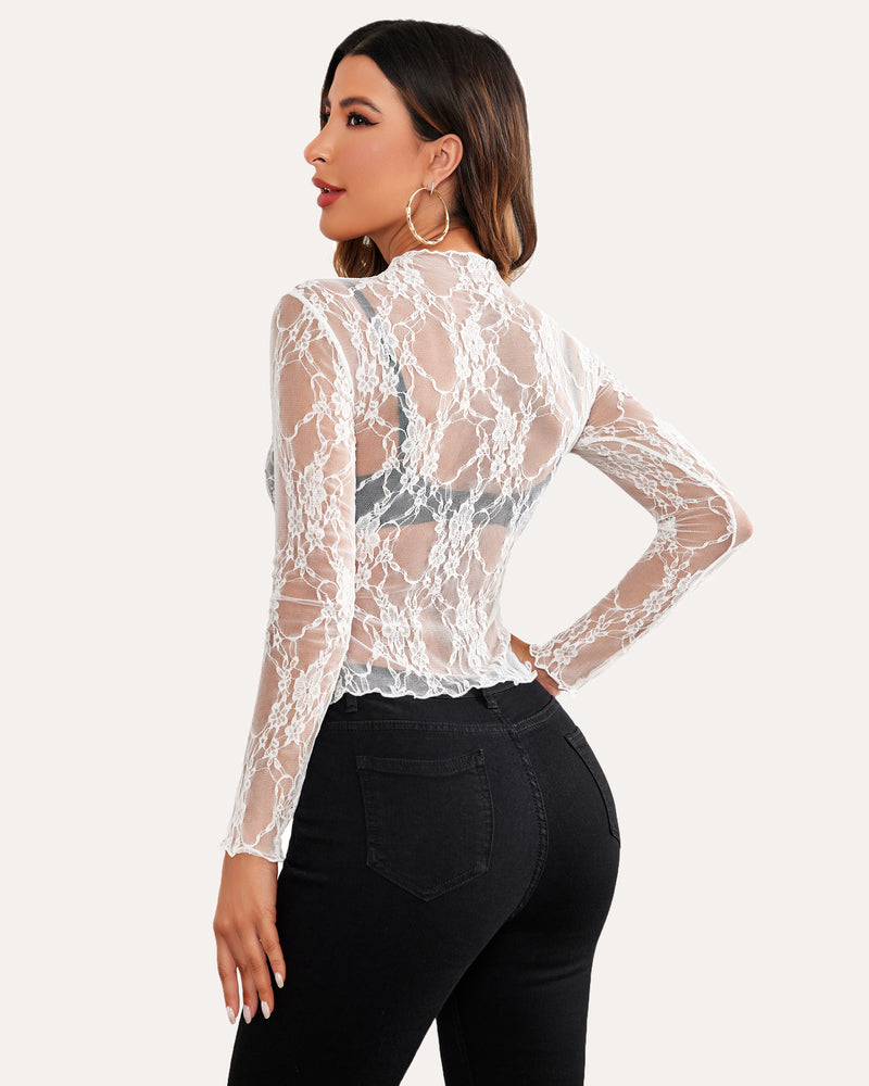 White floral lace sheer blouse with mock neck and long sleeves on a woman, sexy mesh top