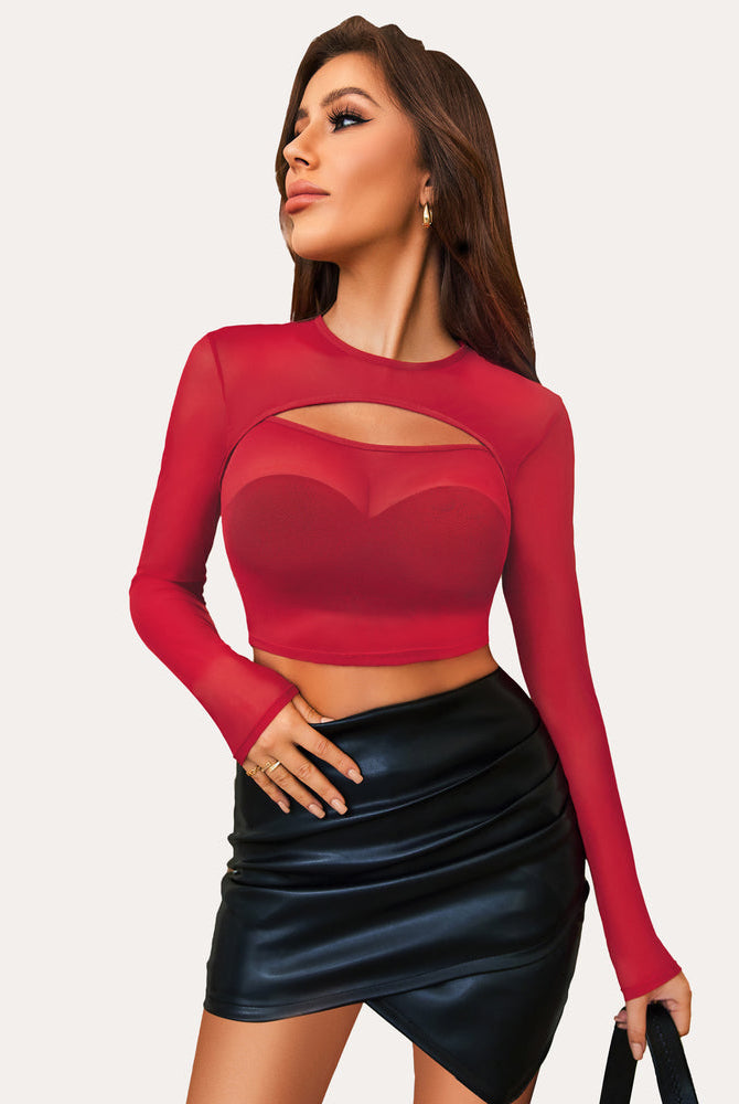 Red mesh cutout crop top, long sleeve, with black mini skirt. Perfect for party or club wear.