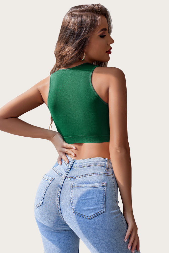 Green crop top and light wash jeans. Comfortable, breathable crop tank top for women.