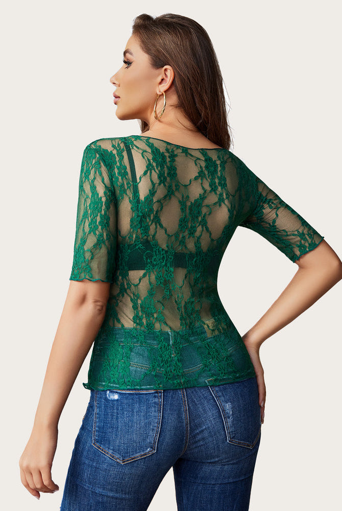 Green floral lace mesh top with short sleeves, styled with jeans. Sexy and confident fashion.
