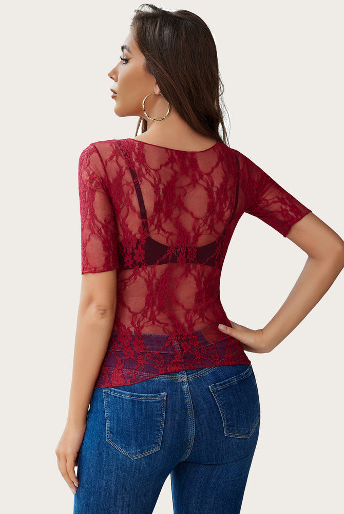 Burgundy floral lace mesh top with blue jeans. Sexy and confident style for women.
