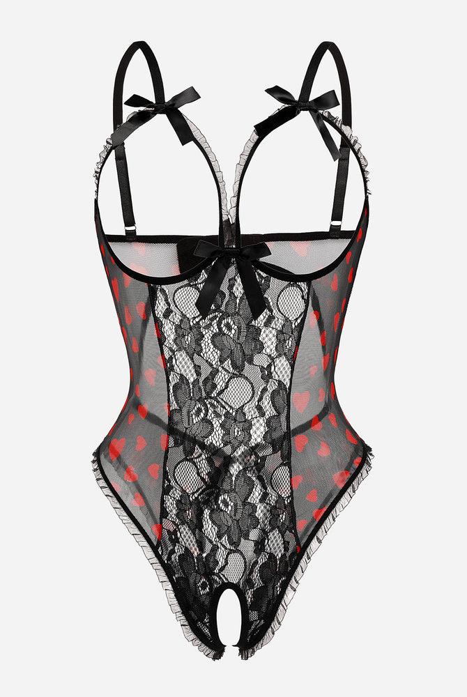 Black lace cut-out bodysuit with heart accents, adjustable straps, and open back. Sexy lingerie.