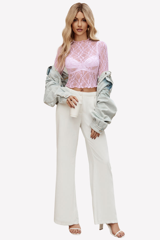 Pink floral lace mock neck sheer blouse, paired with white pants, perfect for layering style.