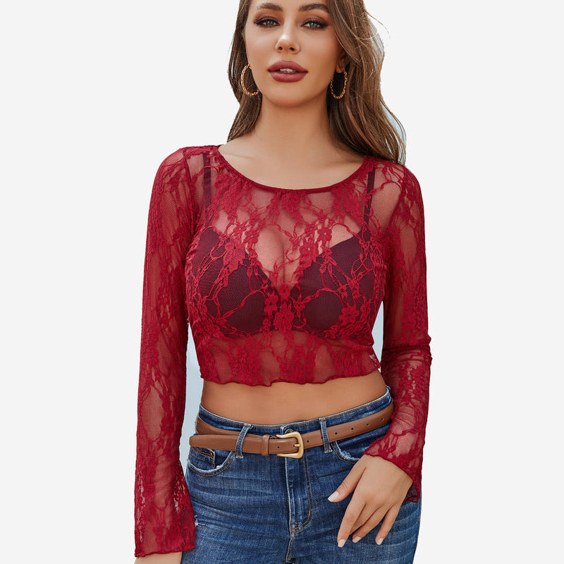 Red floral lace sheer top with bell sleeves and blue jeans. Classy and elegant.
