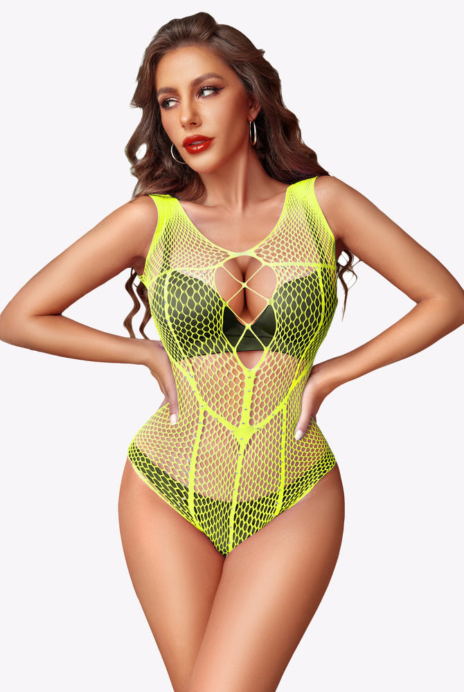 Neon yellow-green rhinestone fishnet bodysuit with heart cutout and thong legs