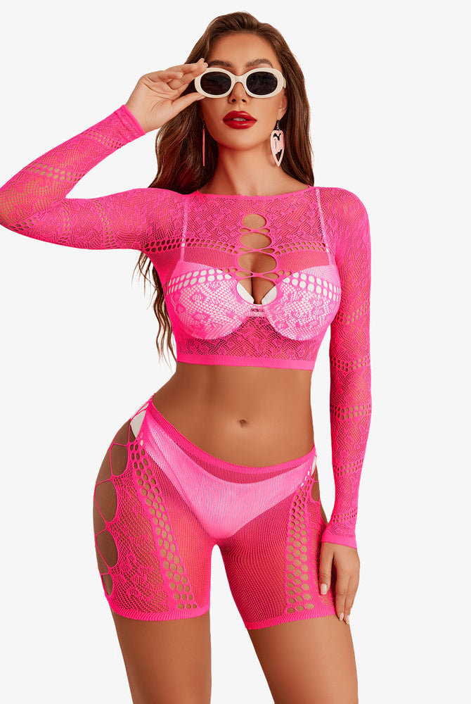 Neon pink fishnet lingerie set, cutout crop top and shorts, designed for a confident, sexy style.