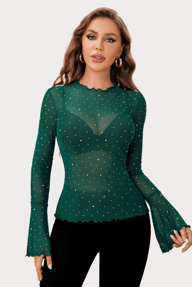 Emerald green mesh rhinestone top with mock neck and bell sleeves, creating a sexy look.