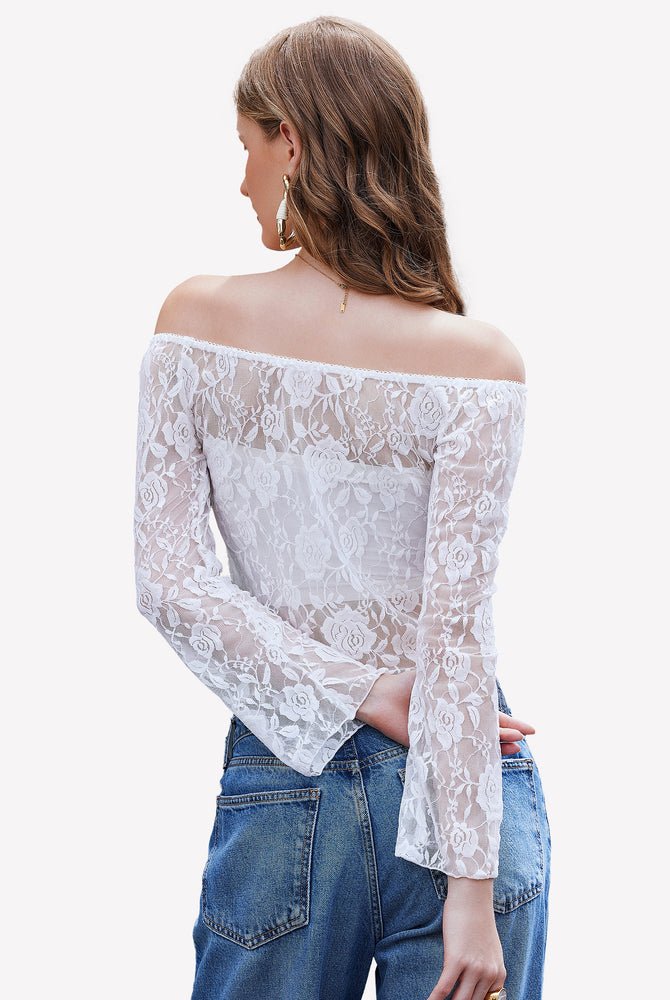 White lace Y2k off-shoulder crop top with bell sleeves and jeans, floral design, chic outfit