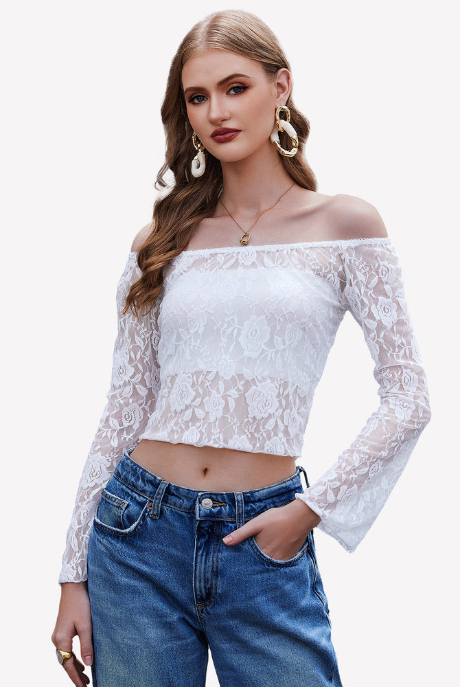 White lace Y2k off-shoulder crop top with bell sleeves and jeans, floral design, stylish outfit