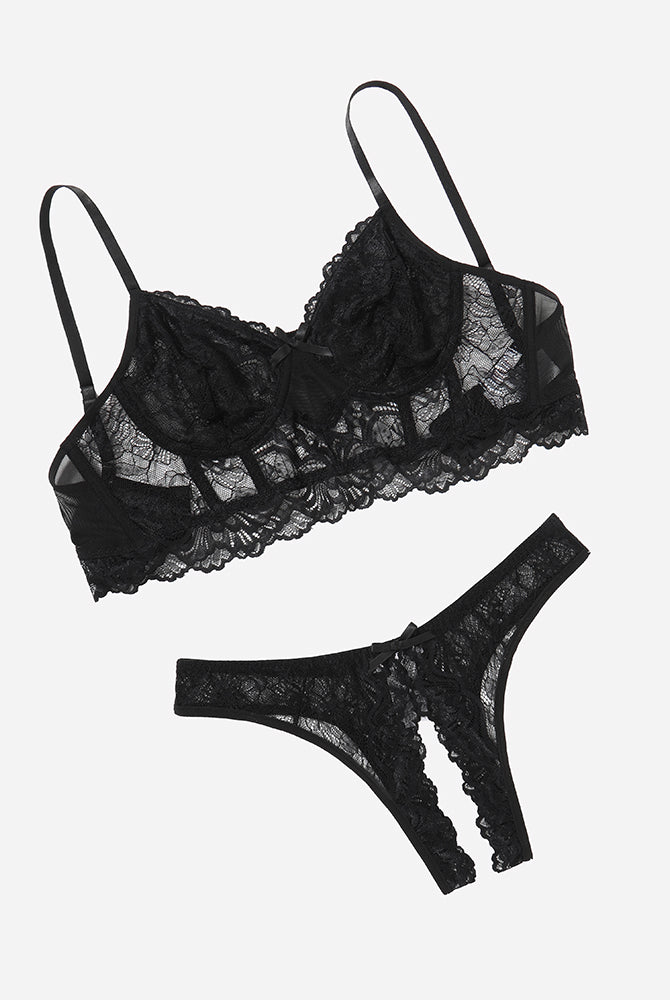Black lace bra and crotchless panty set with bow details, offering a flattering and sexy look.