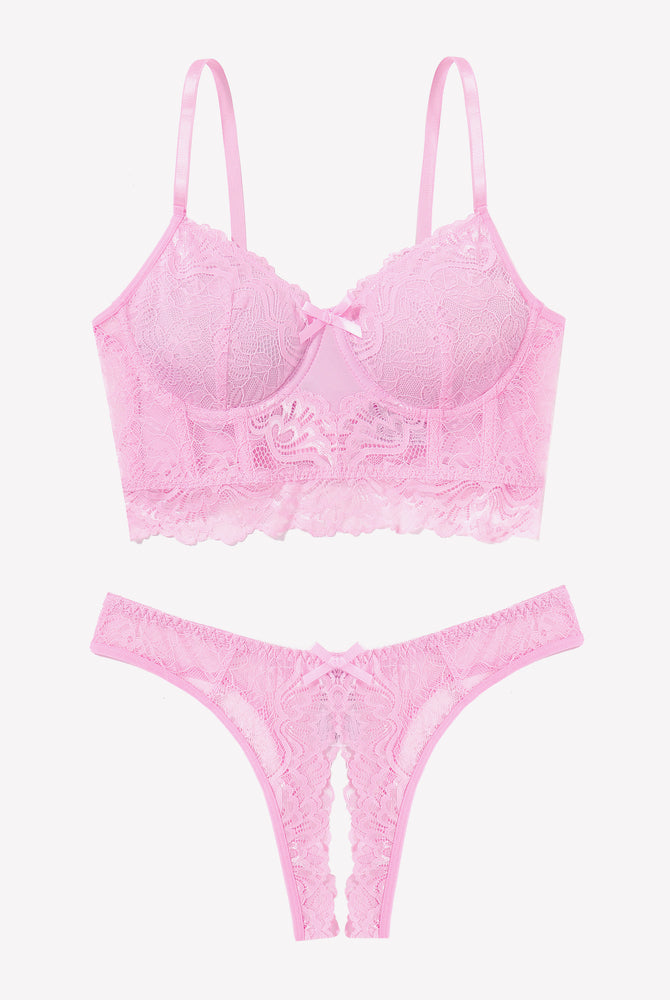 Pink lace lingerie set with bra and crotchless panty, offering a flattering and sexy look