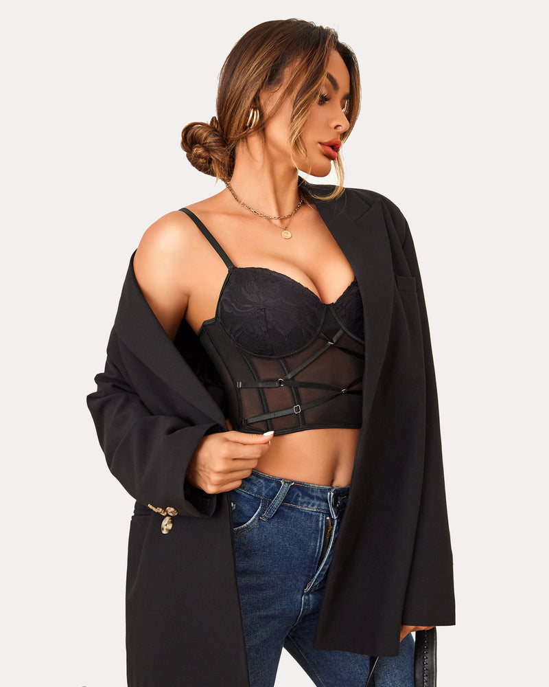 Black lace corset top with mesh design, black blazer, and blue jeans. Sexy lingerie.
