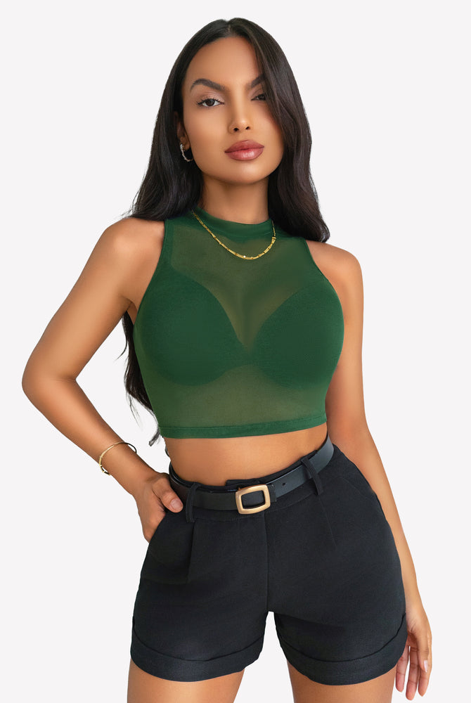 Green mesh crop top, black shorts. A sexy and stylish outfit for women. Confident, modern look.
