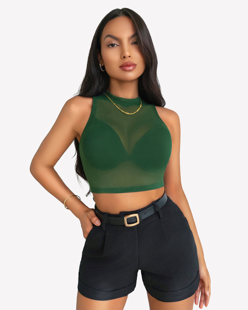 Green mesh crop top, black shorts. A sexy and stylish outfit for women. Confident, modern look.