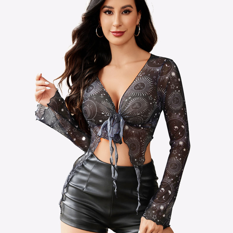 Mesh crop top, tie front detail with celestial print, black shorts. Perfect for Y2K fashion.