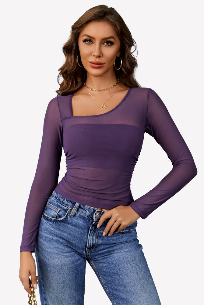 Avidlove purple mesh asymmetrical crop top, showcasing neckline details, with blue jeans.