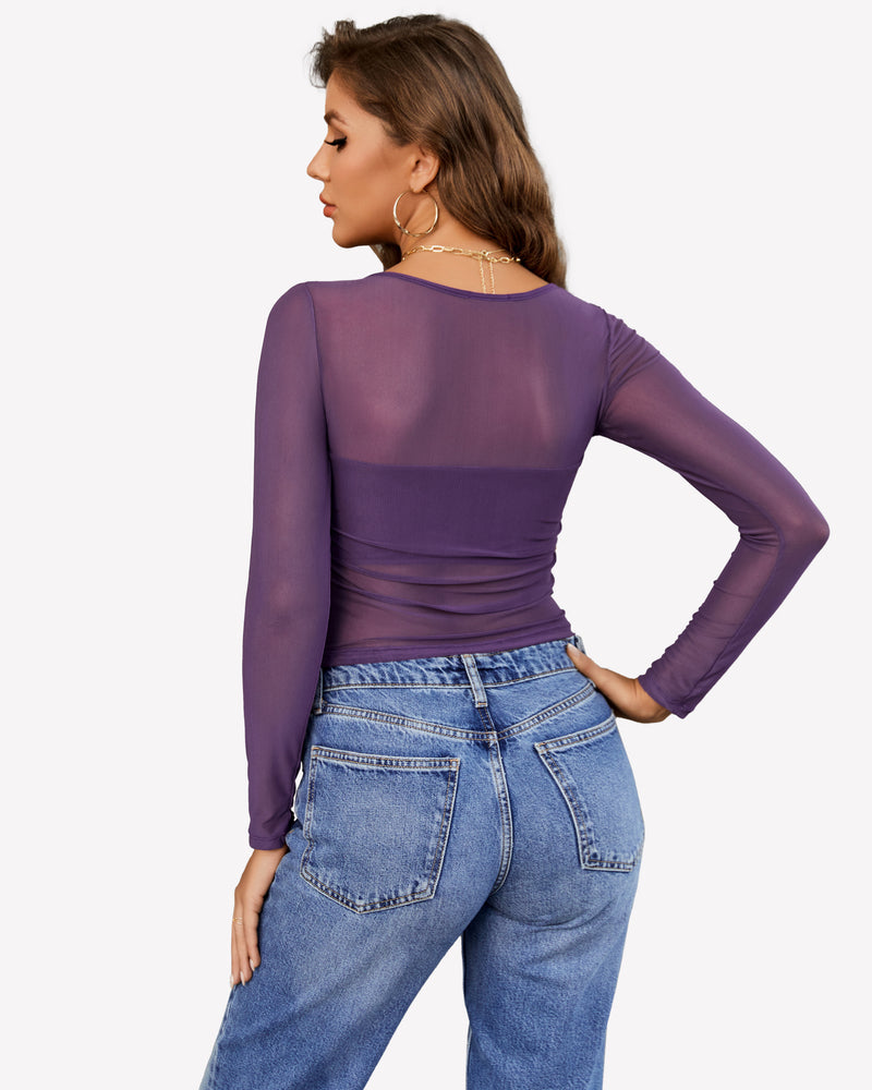 Avidlove purple mesh asymmetrical crop top with long sleeves and blue jeans. Stylish sheer top.