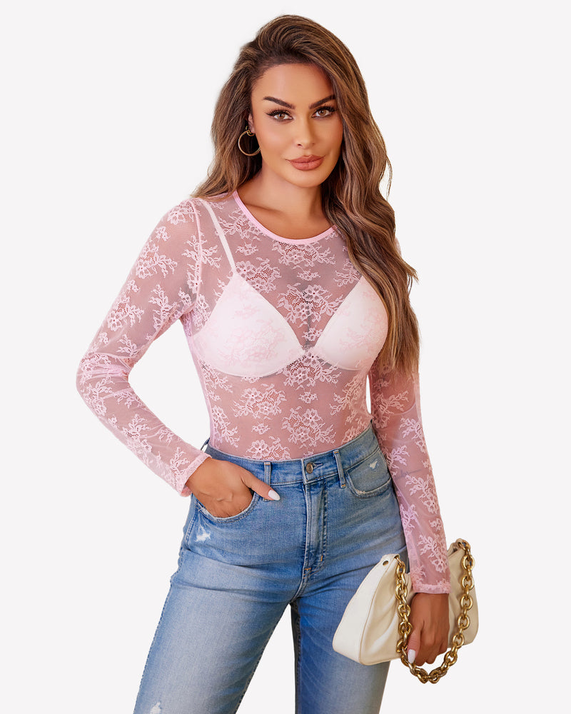 Pink lace mesh top, long sleeves, white bra, and blue jeans. Festival and party wear. Sheer blouse.