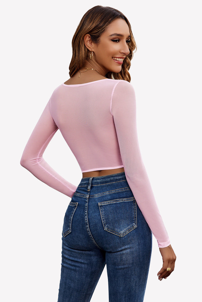 Pink sheer long sleeve crop top with blue jeans - Sexy and comfortable outfit