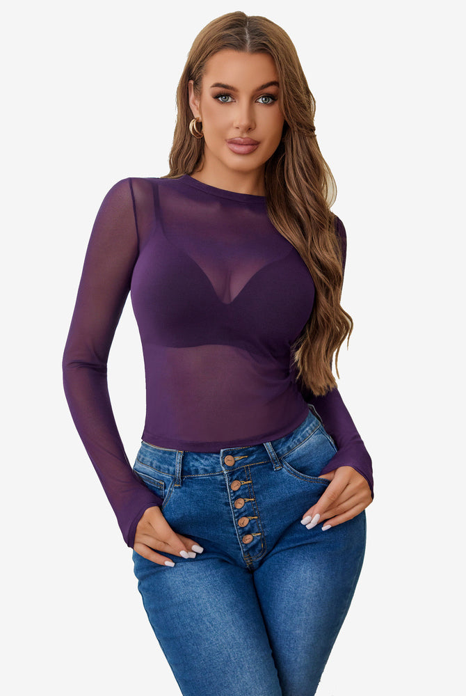 Purple sheer blouse with long sleeves, paired with blue denim jeans. Sexy lingerie style for women.