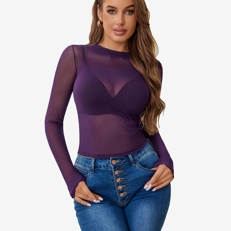 Purple sheer blouse with long sleeves, paired with blue denim jeans. Sexy lingerie style for women.