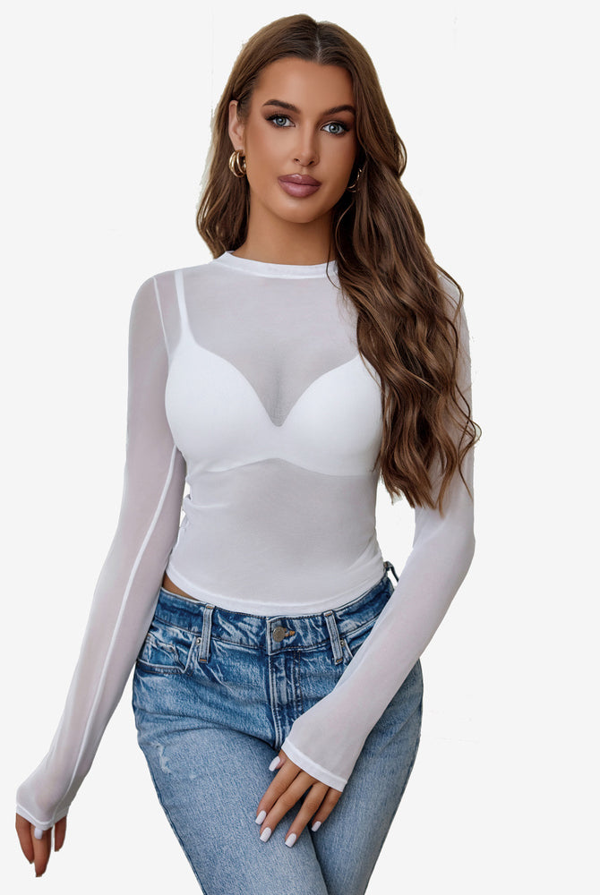 White sheer blouse with long sleeves paired with blue jeans. Avidlove sexy lingerie style.