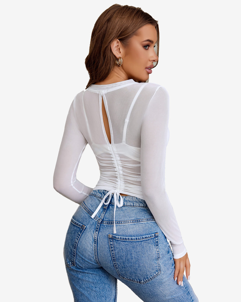 White sheer blouse with keyhole back and drawstring detail paired with jeans. Avidlove lingerie.