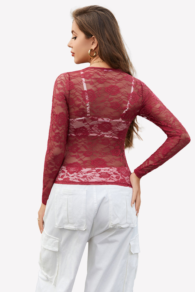 Burgundy mesh sheer floral lace shirt with floral embroidery, paired with white pants.
