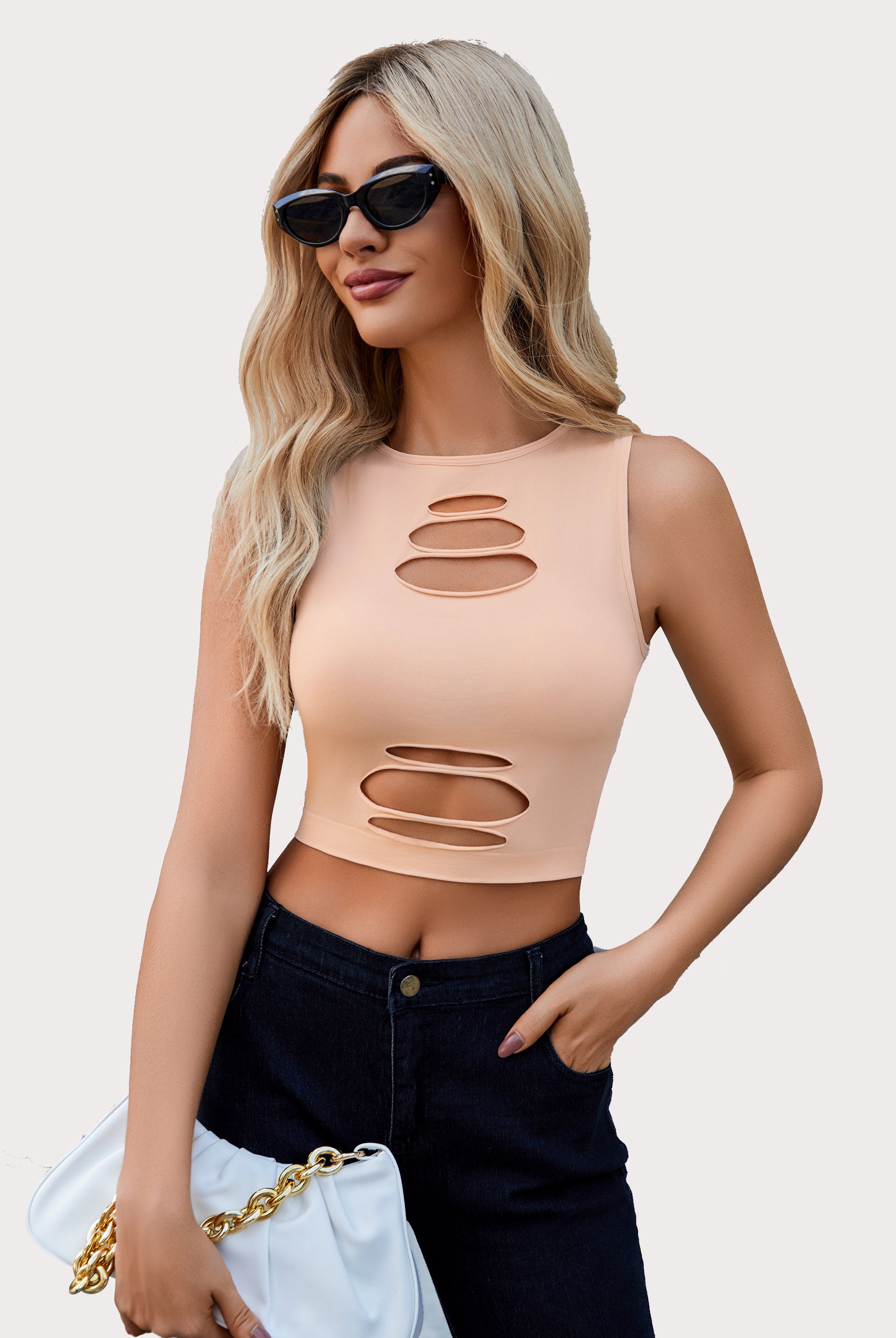 Beige cut-out crop tank top with dark denim shorts, fashionable for women.
