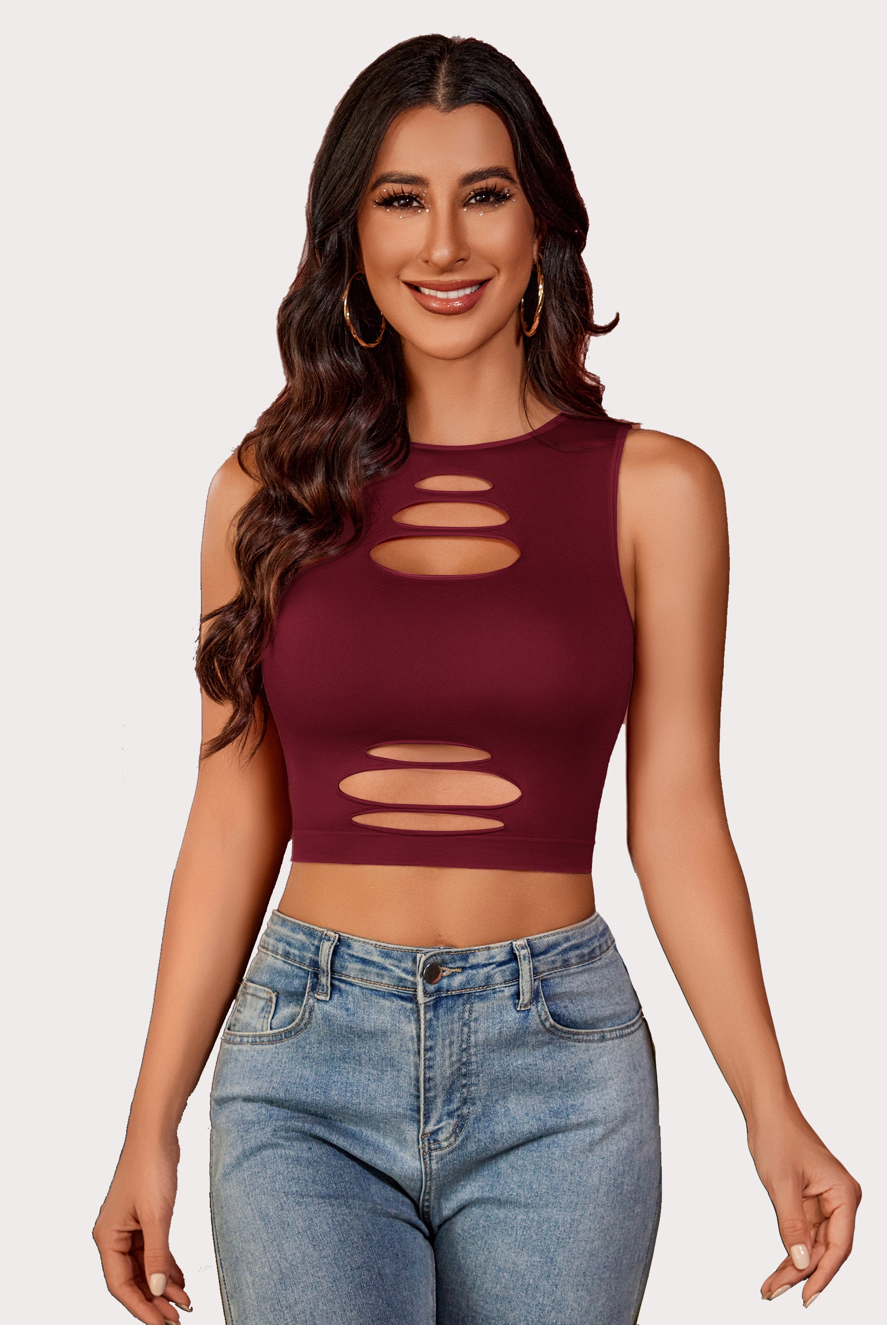 Burgundy cut-out crop top and denim jeans, fashionable, showing curves. Fishnet crop top