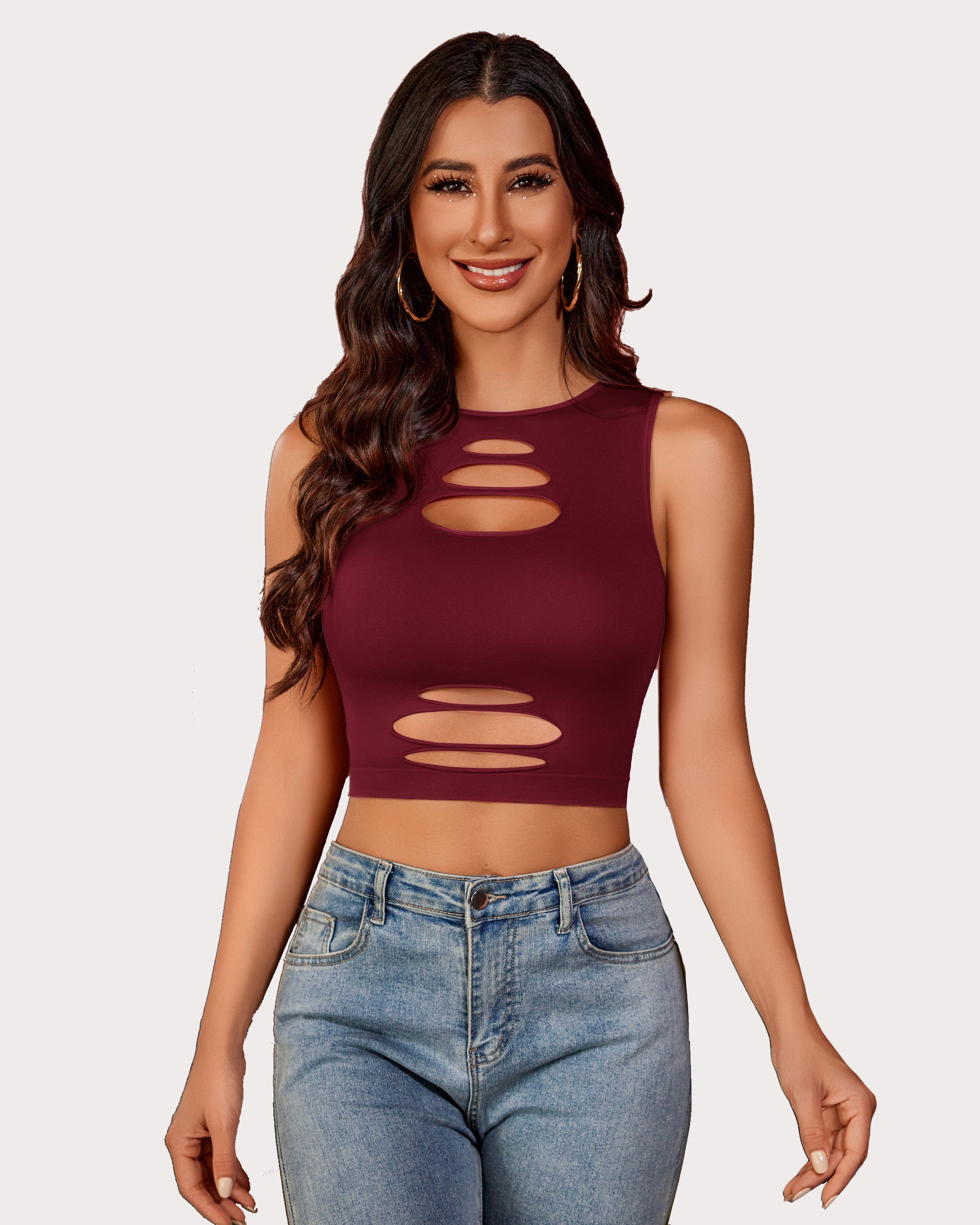 Burgundy cut-out crop top and denim jeans, fashionable, showing curves. Fishnet crop top