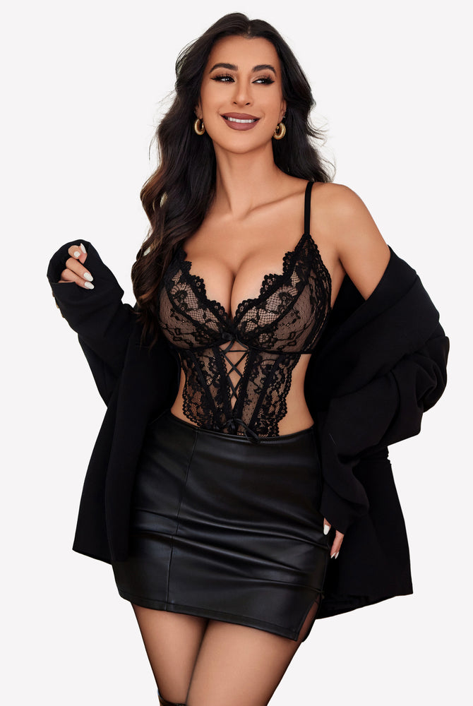 Black lace teddy lingerie with adjustable straps, black blazer and leather skirt, confident woman