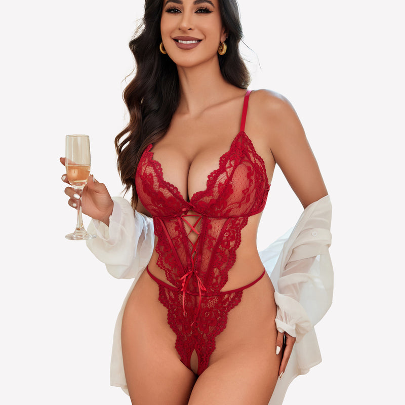 Red lace teddy lingerie with adjustable straps, a confident woman holding champagne.