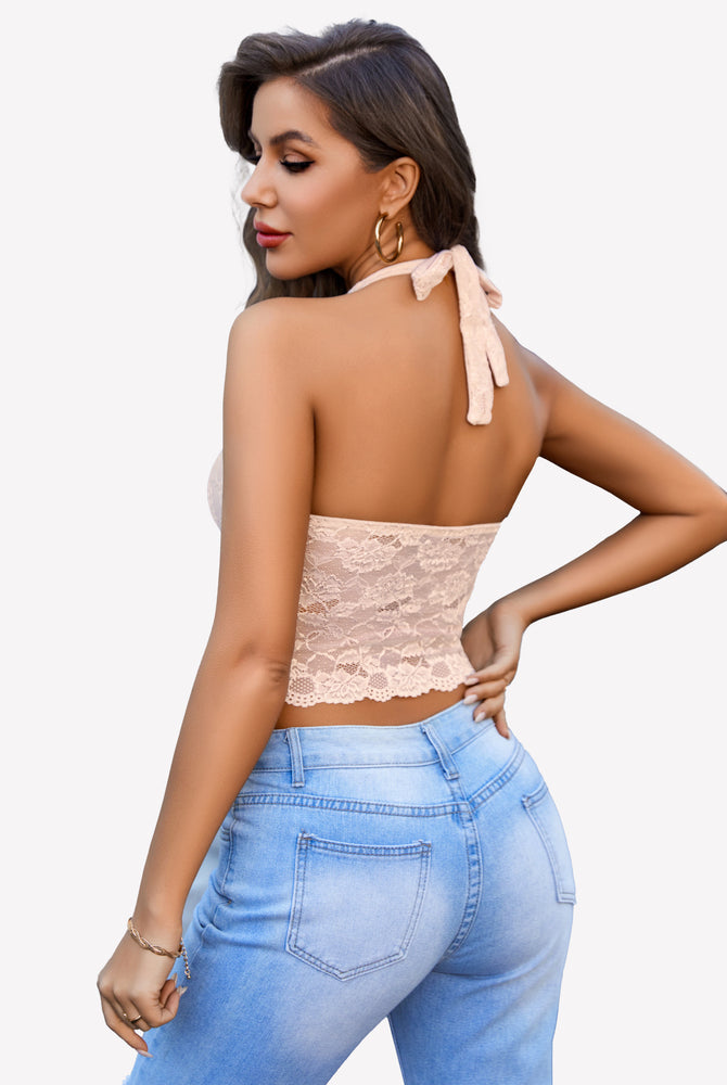 Peach lace V-neck halter top tank top with light blue jeans, confident and charming look.