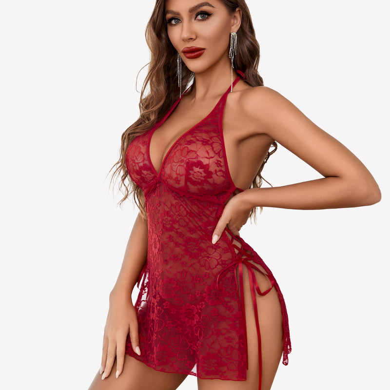 Red lace boudoir outfit with halter neck, side slit, and lace-up details. Sexy lingerie.