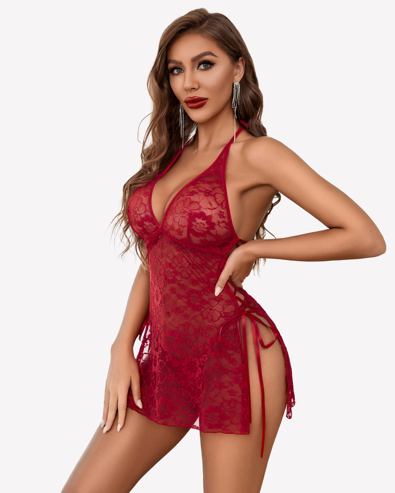Red lace boudoir outfit with halter neck, side slit, and lace-up details. Sexy lingerie.