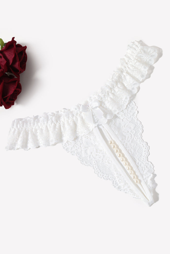 White lace thong with pearl accents, low waist design, sensual lingerie.