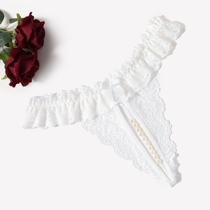 White lace thong with pearl accents, low waist design, sensual lingerie.