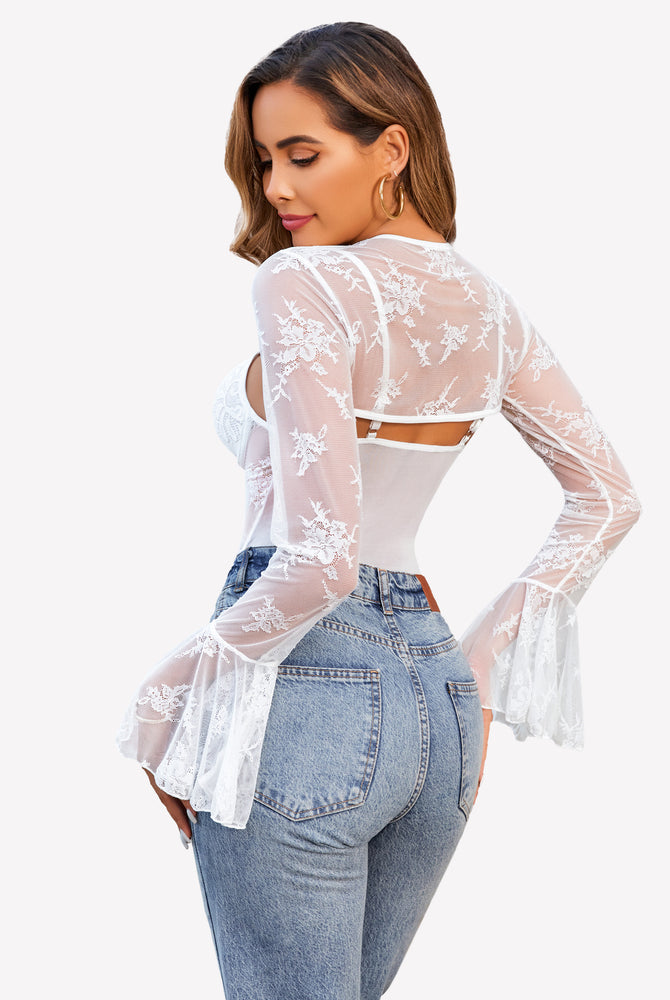 White lace bodysuit with crop top and bell sleeves, paired with blue jeans. Sexy lingerie for women.
