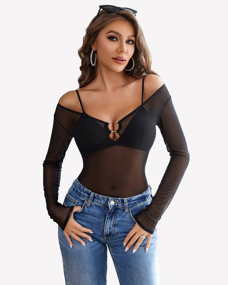 Black mesh long sleeve blouse top with off-shoulder design and ring detail, paired with blue jeans.