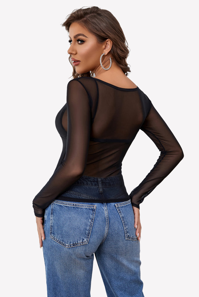 Black mesh long sleeve blouse, off-shoulder option, paired with blue jeans; sexy and stylish.