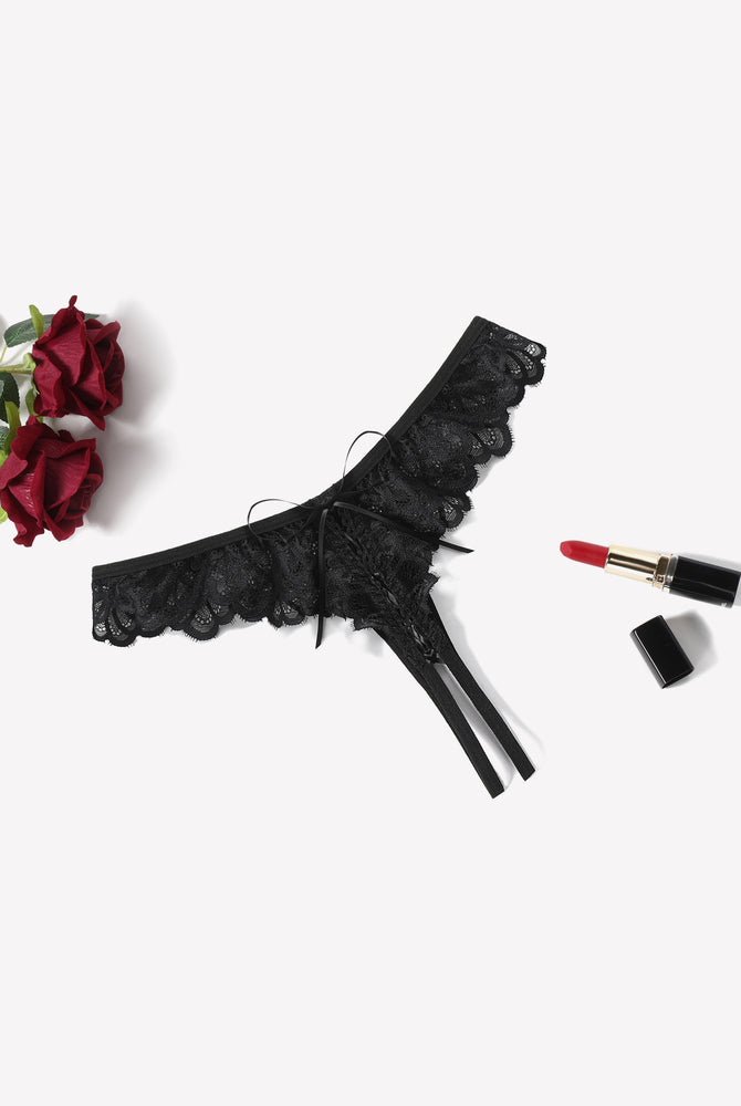 Black lace thong briefs with criss-cross design and bow, perfect for special occasions