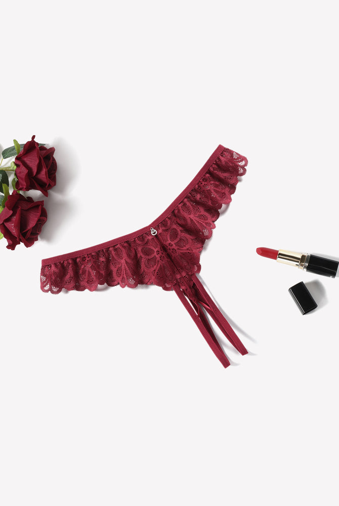 Burgundy lace thong briefs with criss-cross design, ruffle trim, and rhinestone embellishment